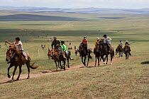 Young jockeys mounted on Mongolian horses, race during the training for the horse race of the national Naadam festival, held from July 11  13; near Ulaanbaatar, Mongolia. 2007