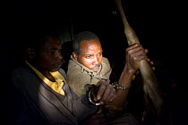 Poachers apprehended by anti-poaching team during night ambush, poachers found with wildebeest and thomson's gazelle meat, Serengeti National Park, Tanzania, August 2007