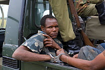 Poacher apprehended by Mara Conservancy anti-poaching patrol rangers, caught with wildebeest and impala meat, Serengeti National Park, Tanzania, August 2006