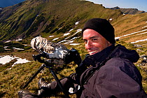 Photographer, Bruno D'Amicis, at work in a mountain valley, Western Tatras, Carpathian Mountains, Slovakia, June 2009