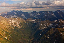 Aerial view of the end of Ticha valley and the High Tatras with Mount Krivan (2,495m) on the right and Mount Gerlach (2,655m) in the background, Western Tatras, Carpathian Mountains, Slovakia, June 20...