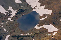 Alpine lake created by melting snow, High Tatras, Carpathian Mountains, Slovakia, June 2009