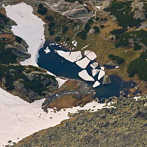 Alpine lake created by melting snow, High Tatras, Carpathian Mountains, Slovakia, June 2009
