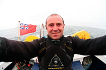 Photographer, Nuno S, on boat, Mull, Scotland, June 2009