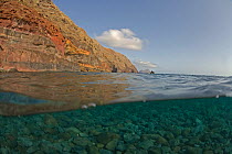 Deserta Grande coastal cliffs and pebbles on seabed, Desertas Islands, Madeira, Portugal, August 2009