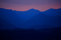 Mountains silhouetted near the ruins of Mycenae, The Peloponnese, Greece, May 2009