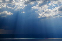 Ray of light shining through thunder clouds over Lake Ohrid, Galicica National Park, Macedonia, June 2009