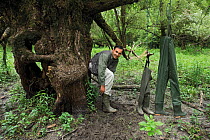 Photographer, Elio della Ferrera, with selection of waterproof boots /wellingtons and trousers Lonjsko Polje Nature Park, Croatia Bosnia and Herzegovina border, June 2009