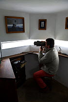 The lookout "vigia" in his white tower looking for whales, Pico island, Azores, Portugal, June 2009, model released