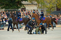 The Garde Républicaine (Republican Guard), part of the French Gendarmerie, mounted on Selle Français horses, demonstrate how they maintain security in the streets of Paris, Caserne des Célestins, P...