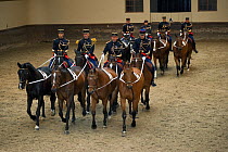 Mounted officers of the Garde Républicaine (Republican Guard), part of the French Gendarmerie, performing The Tandems mounted on Selle Français horses at the Caserne des Célestins, Paris, France. O...
