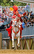 Il Capitano del Gruppo del Commune (the captain of the group of the communes), dressed in white and red, opens the Palio, on the third Sunday of September, in Asti, Piedmont, Italy, September 2009