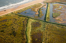 Aerial view of saltmarsh and lagoons at Titchwell RSPB Reserve, North Norfolk, UK, October 2006