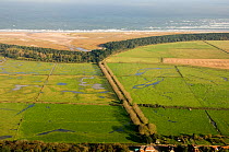Aerial view of Lady Anne's Drive bordered by grazing marsh, Holkham, North Norfolk, October 2006