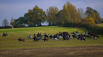 Participants galloping across the rolling open landscapes at the opening meet of the Quorn Hunt, in Leicestershire, England, UK.  October 2009