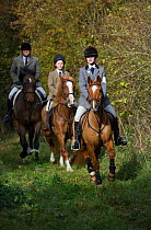 A family out hunting at the opening meet of the Quorn Hunt, in Leicestershire, England, UK.  October 2009
