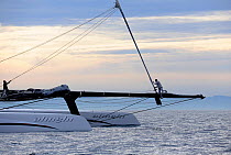 Crew on bowsprit of 90ft catamaran "Alinghi 5" training prior to the first race of the 33rd America's Cup, Valencia, Spain. February 2010. ^^^A Deed of Gift race between defender Ernesto Bertarelli's...