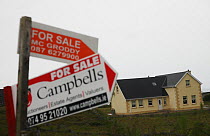 New house with For Sale signs, Bloody Foreland, County Donegal, Republic of Ireland, June 2009
