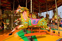 Horses on merry-go-round, Hengate, Suffolk, England, September 2008