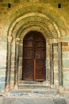 Doorway of entrance to Church of the nativity, Durro. Romanesque church from XII century, and UNESCO world heritage, in the Boí Valley, Pyrenees, Lleida, Catalonia, Spain. July 2009