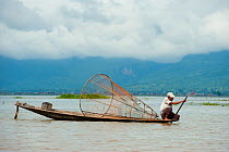 Traditional fisherman, with nets. These fishermen row their boats using their feet. Inle Lake, Shan State, Myanmar, Burma August 2009
