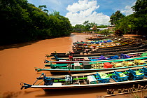 Boats docked on narrow river, around Inle Lake, Shan State, Myanmar, Burma. August 2009