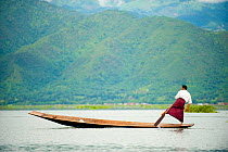 Traditional fishermen who rows with the feet, in Inle Lake, Shan State, Myanmar, Burma. August 2009