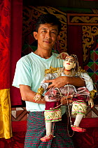 Puppeteer with traditional puppet in Nyaungshwe, Inle Lake, Shan State, Myanmar, Burma. August 2009