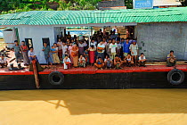 People onboard the boat in the Ayeyarwady river, from Mandalay to Bagan, Myanmar, Burma. September 2009