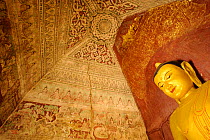 Fresco and Buddha statue inside a temple in Old Bagan, UNESCO World Heritage, Mandalay State, Myanmar, Burma. September 2009