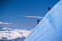 Climbers on summit ridge at 6,000m, Mount Illampu, Bolivia, March 2005. Freeze Frame book plate page 137.