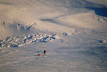Man pulling sledge during filming for polar bear sequence of BBC tv series Planet Earth, Kong Karls Land, Svalbard archipelago, Norwegian high Arctic