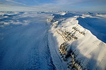 Aerial of mountains and glacier stream in Svalbard, Norwegian Arctic, June 2004