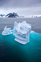 Aerial view of iceberg, with majority of berg visible under the water, Antarctic peninsula, February 2007