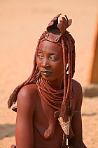 Woman with distinctive headdress, a member of the Himba tribe, Kaokoland, Namibia, August 2007