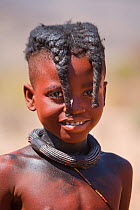 Himba girl with two distinctive plaits, Kaokoland, Namibia, August 2007