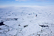 Aerial view of broken ice on route to the North Pole, with ice breaker between ice, Russian Arctic, July 2008