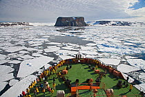Russian Icebreaker, NS 50 Lyet Pobyedi (50 Years of Victory) approaching Rubini Rock, bird colony, Tikhaya Bukhta, Franz Josef Land, Russian Arctic, July 2008