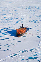Aerial view of Russian nuclear icebreaker, "NS 50 Lyet Pobyedi" (50 Years of Victory) with tourists on ice, at the North Pole, July 2008