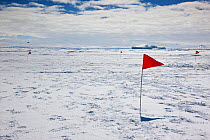Flags on sea ice, Cape Washington, Ross Sea, Antarctica, December 2008