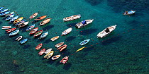 Boats moored in the clear waters of the harbour at Vernazza, Cinque Terre, Italy, 2006.