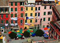 Piazza with colourful buildings and parasols, Vernazza, Cinque Terre, Italy, 2006.