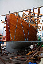 Wooden fishing boat under construction at the Underfall Yard, Bristol, England, UK, Oct 2009.