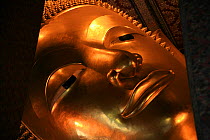 Close-up of giant statue of reclining Buddha, Wat Po temple (the largest Buddhist temple in Thailand) Bangkok, Thailand, October 2006