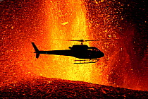 Helicopter flying over volcanic eruption near Eyjafjallajoekull glacier, Iceland, 24th March 2010. Volcano previously dormant since 1821.