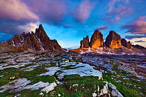 Paternkofel (left) and Tre Cime di Lavaredo mountains a sunset, Tre Cime di Lavaredo, Sexten Dolomites, South Tyrol, Italy, Europe, July 2009. BOOK & WWE OUTDOOR EXHIBITION.