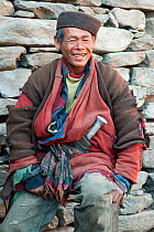 Portrait of smiling man from the Tamang ethnic group, Tamang heritage trail, Gadlang, Langtang region, Nepal. November 2009