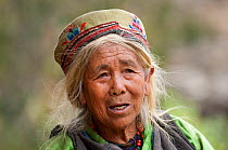 Head portrait of a woman from the Tamang ethnic group, Tamang heritage trail, Thuman, Langtang region, Nepal. November 2009