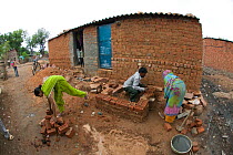 Building an outside toilet in industrial slum, Bhopal, Madhya Pradesh, India, November 2008