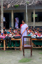 School teacher with class of Primary school children, nr Tala, Ganges delta, Bangladesh, June 2008